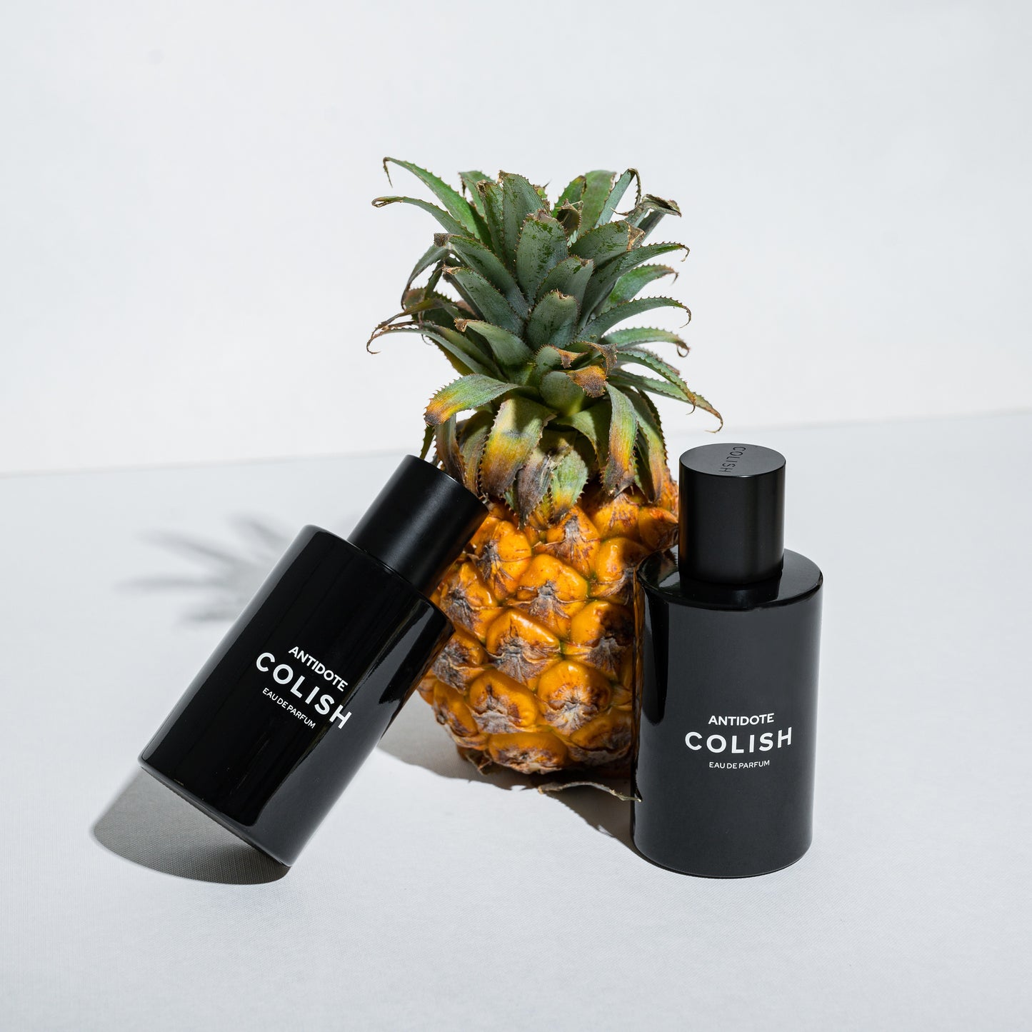 Black Perfume Bottle. Pineapple based woody perfume Pakistan J.